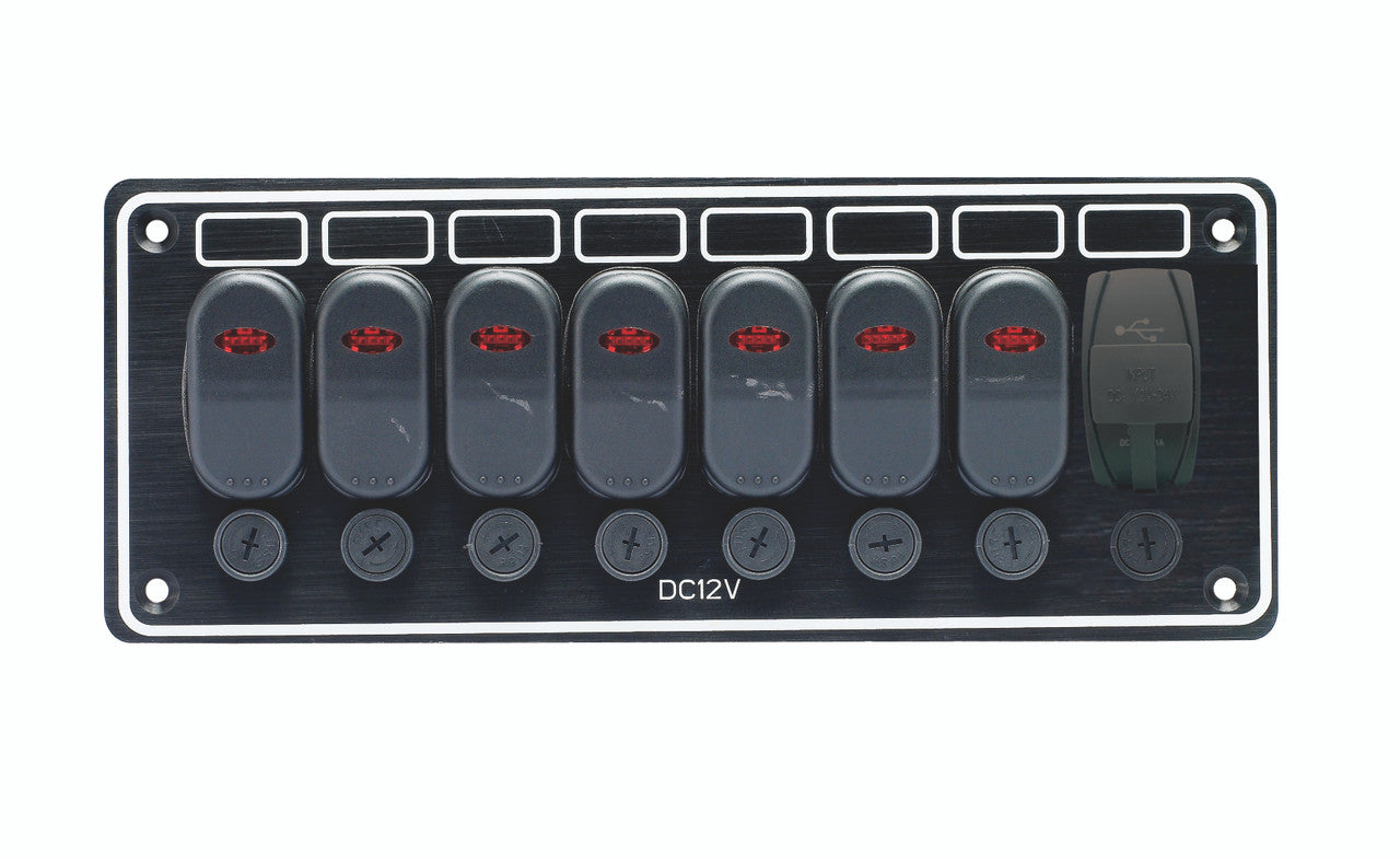 A black aluminum switch panel with LED-illuminated switches, pre-wired with fuses and an integrated USB charger. The panel has a label indicating a 12VDC operation and includes a Type-A and Type-C USB connector.