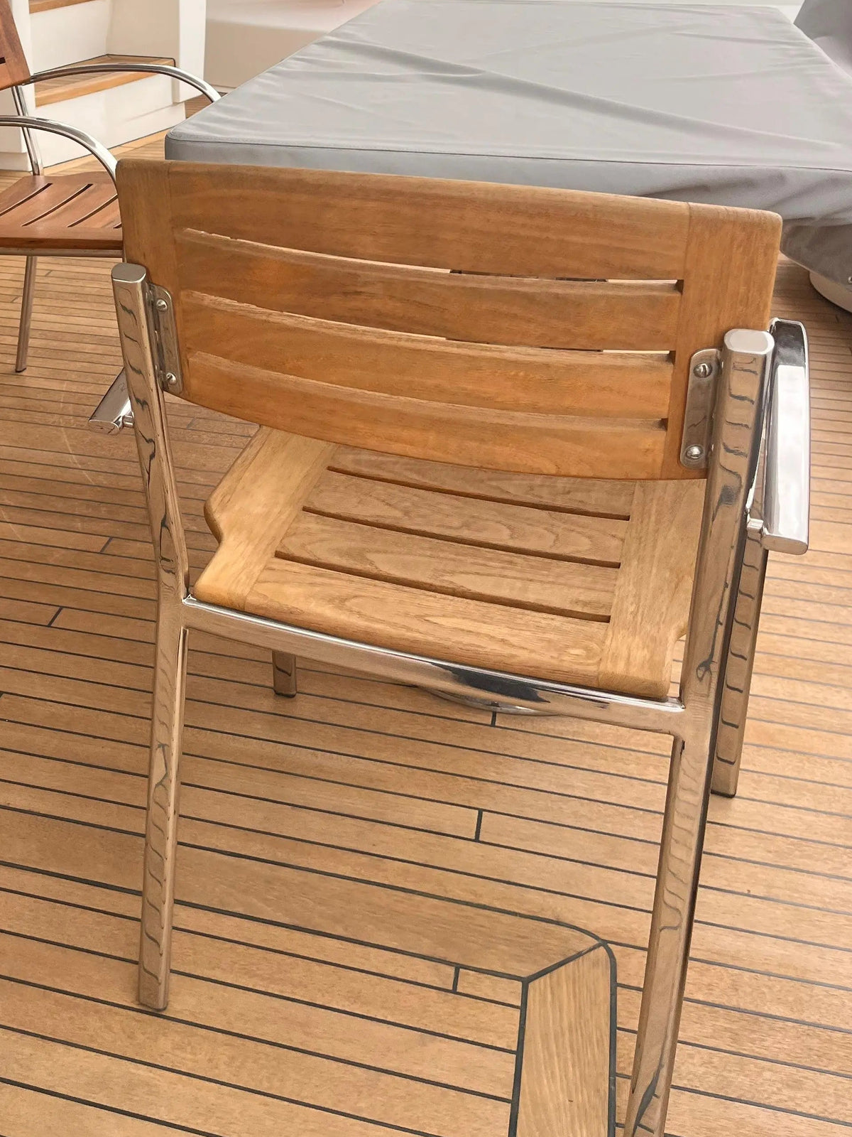 Teak wood backrest with stainless steel frame on yacht chair in Dubai
